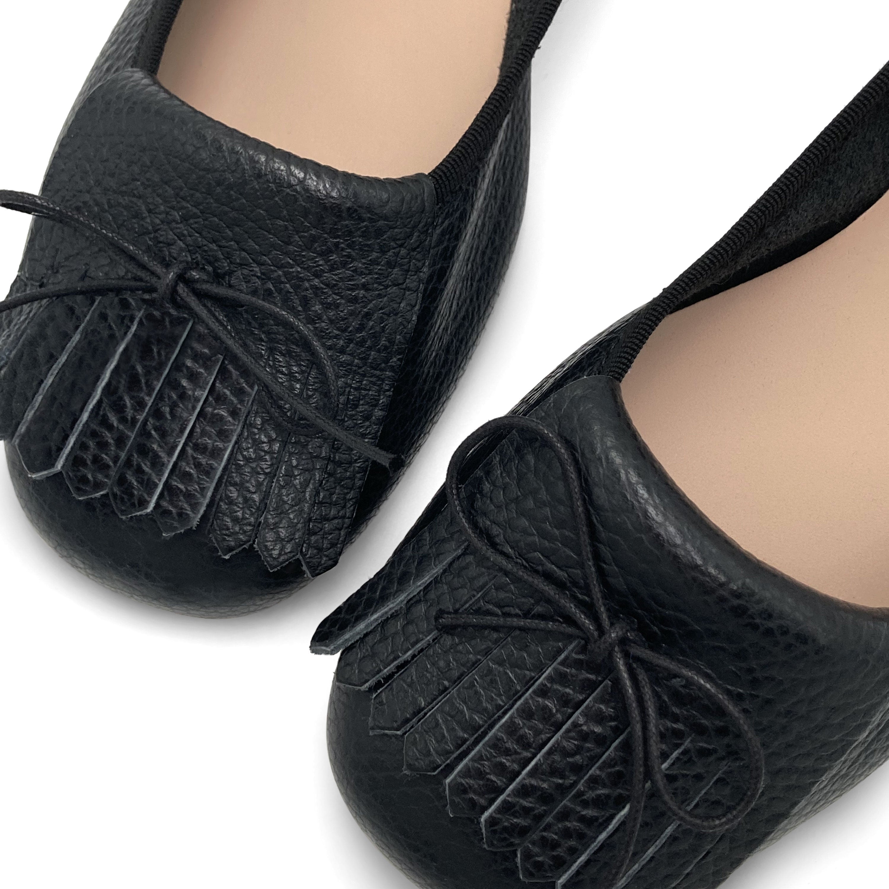 Black leather moccasins with fringe tassel