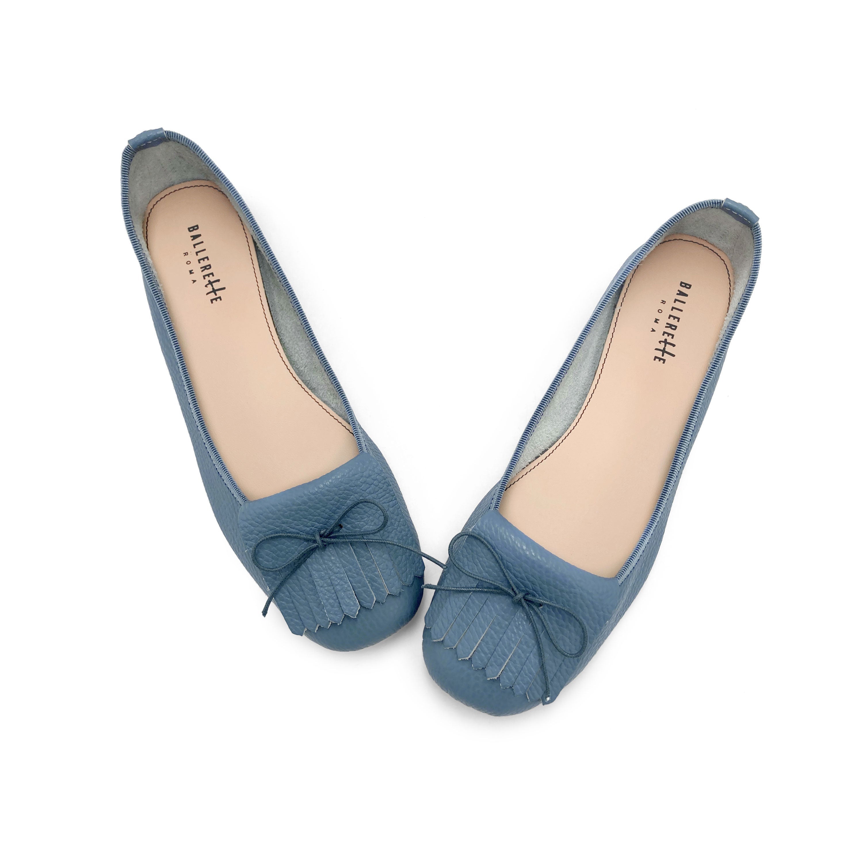 Denim-blue leather moccassins with fringes