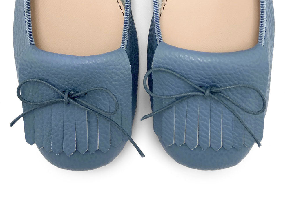 Denim-blue leather moccassins with fringes