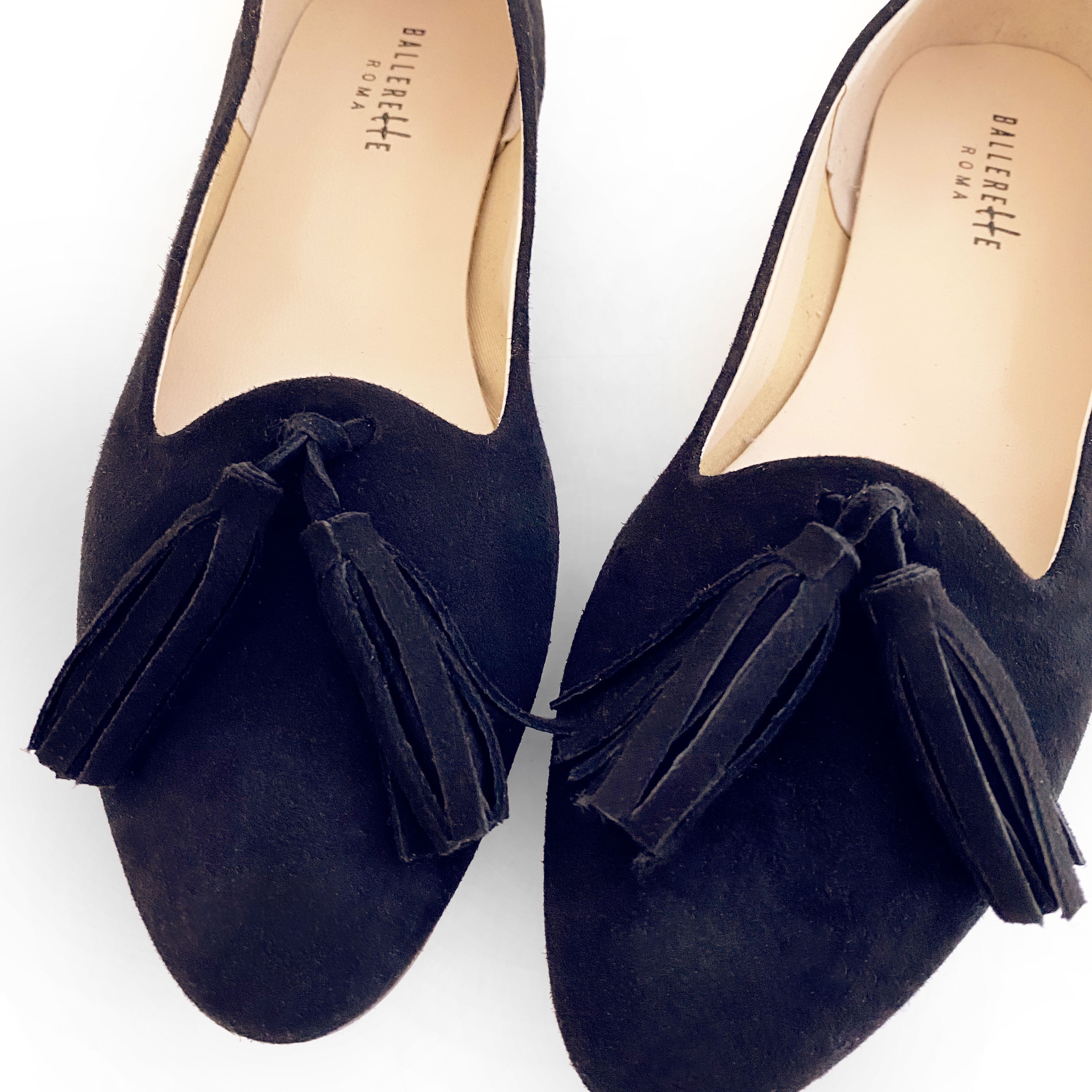 Navy blue suede moccasins with tassels