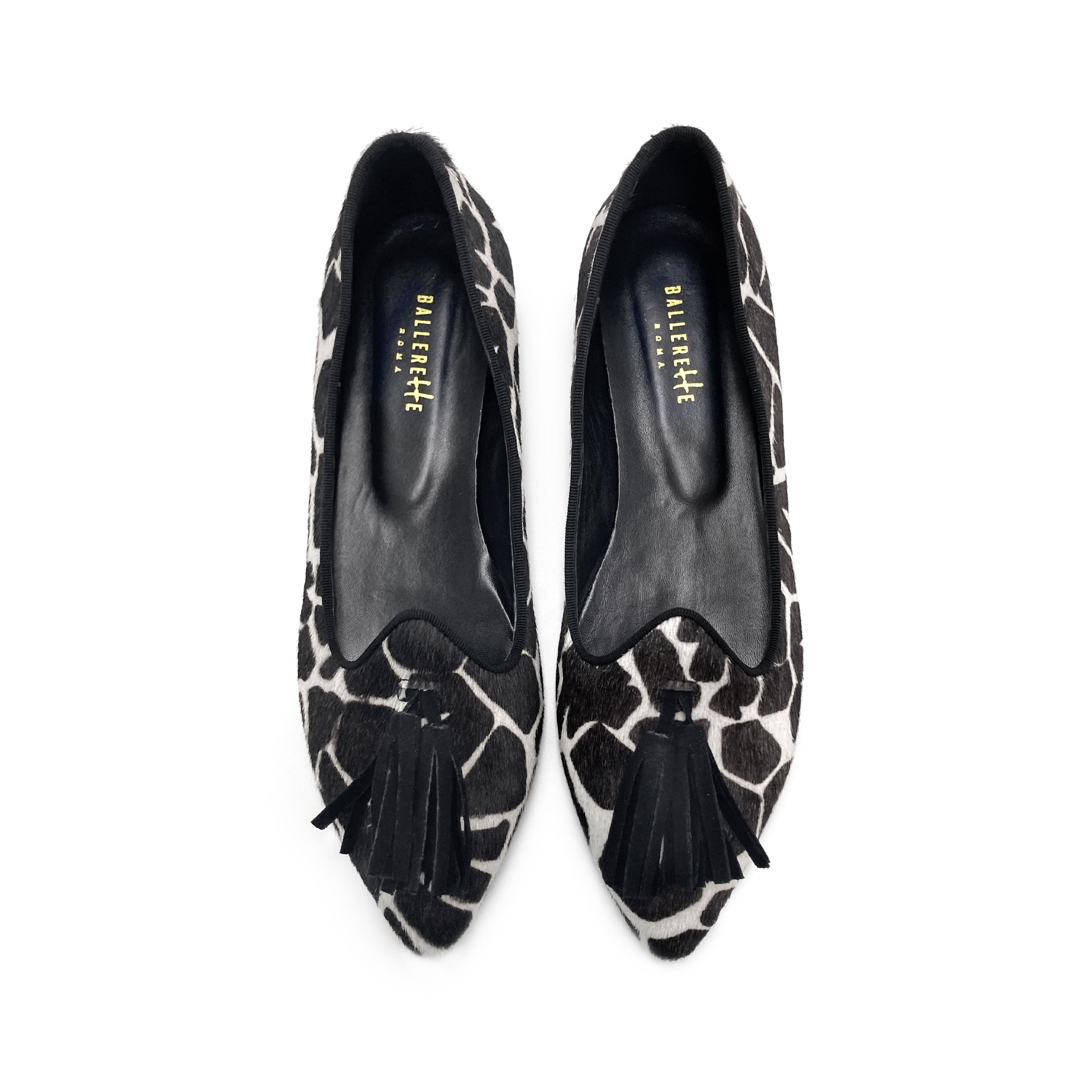 Women's black and white animal print pointed toe moccasins