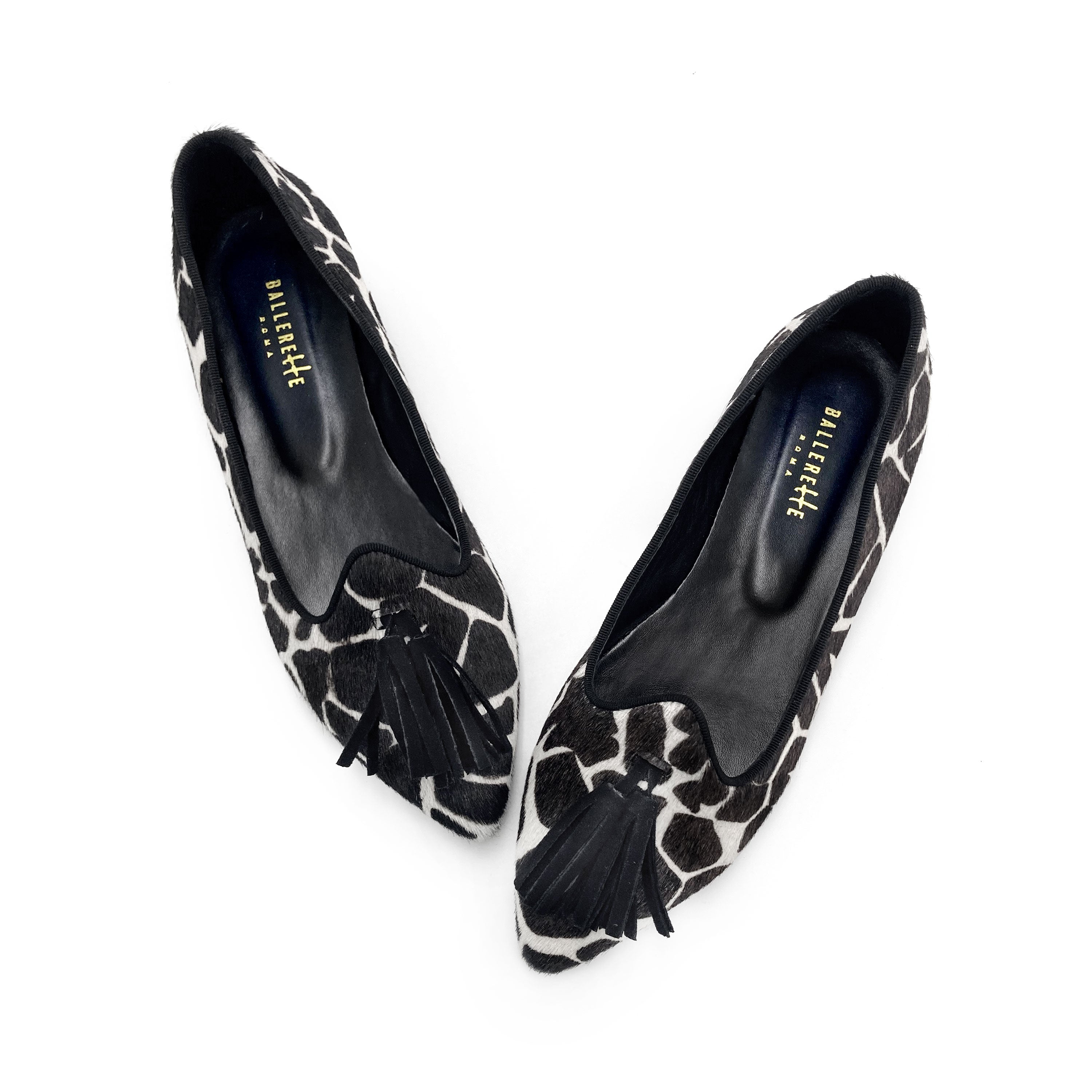 Women's black and white animal print pointed toe moccasins