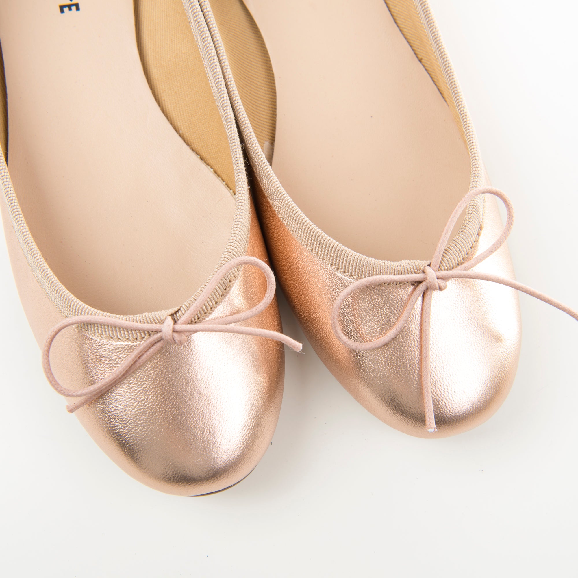 Metallic rose gold ballet flats