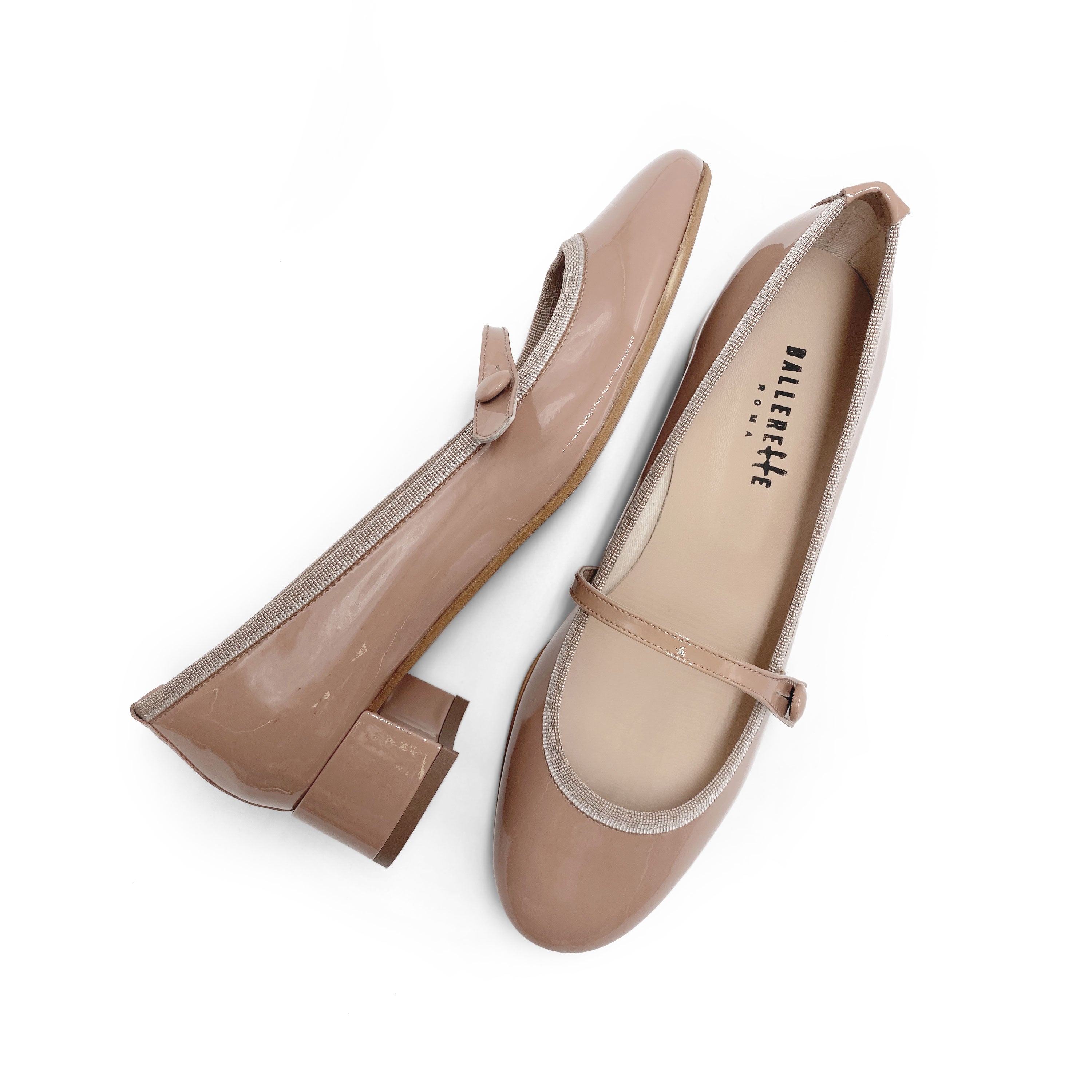 Powder pink patent leather ballet flats with strap and heel