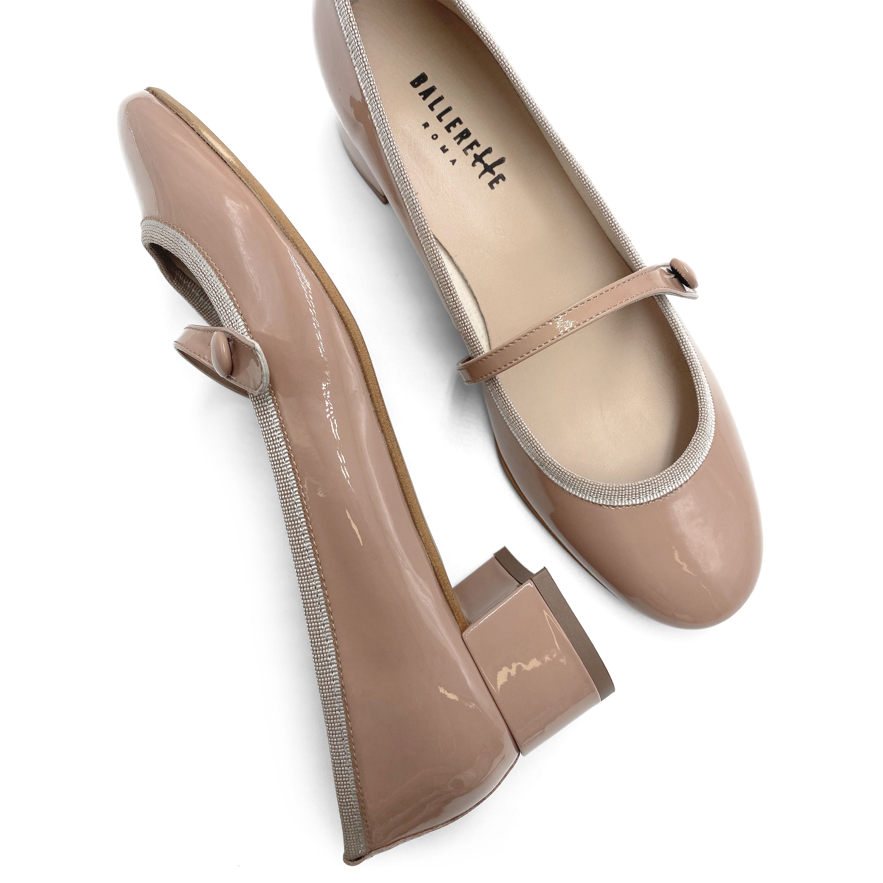 Powder pink patent leather ballet flats with strap and heel