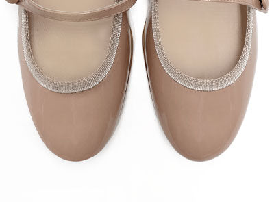 Powder pink patent leather ballet flats with strap and heel