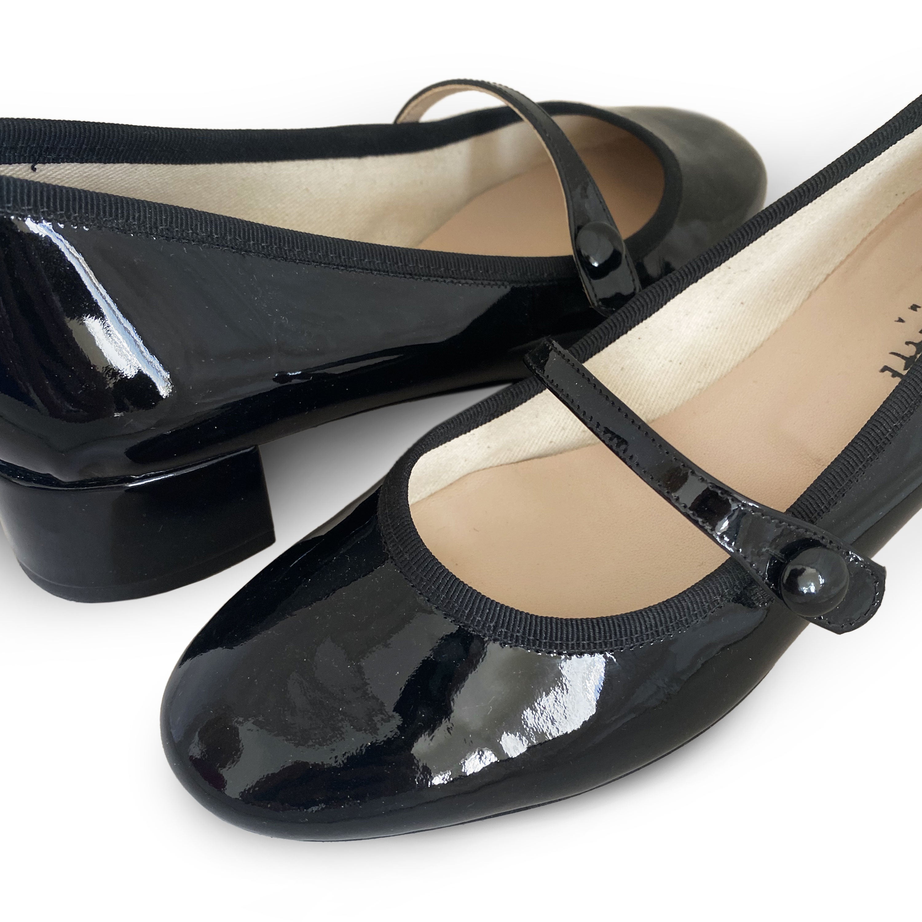 Black patent leather Mary Jane ballet flats with strap and heel