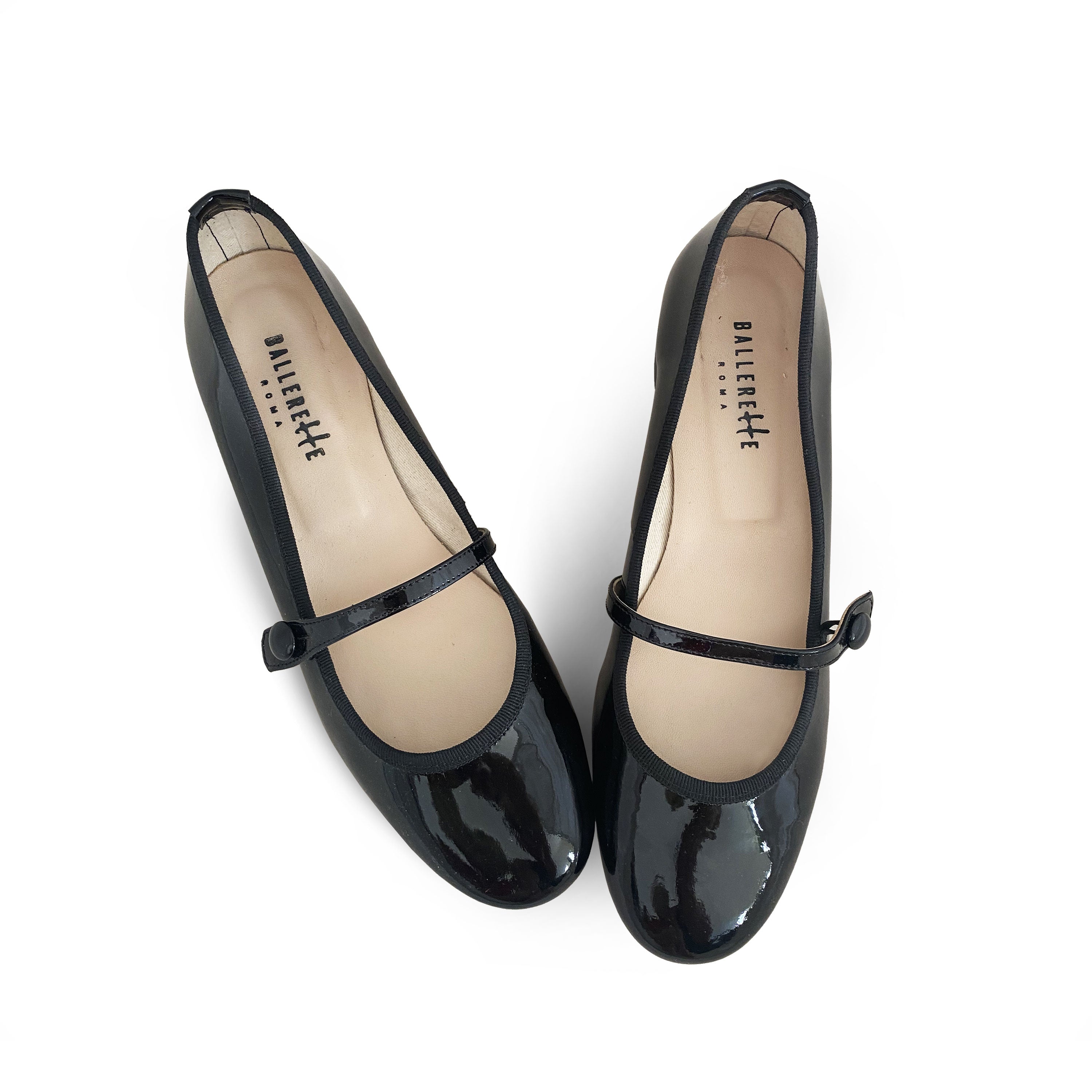 Black patent leather Mary Jane ballet flats with strap and heel