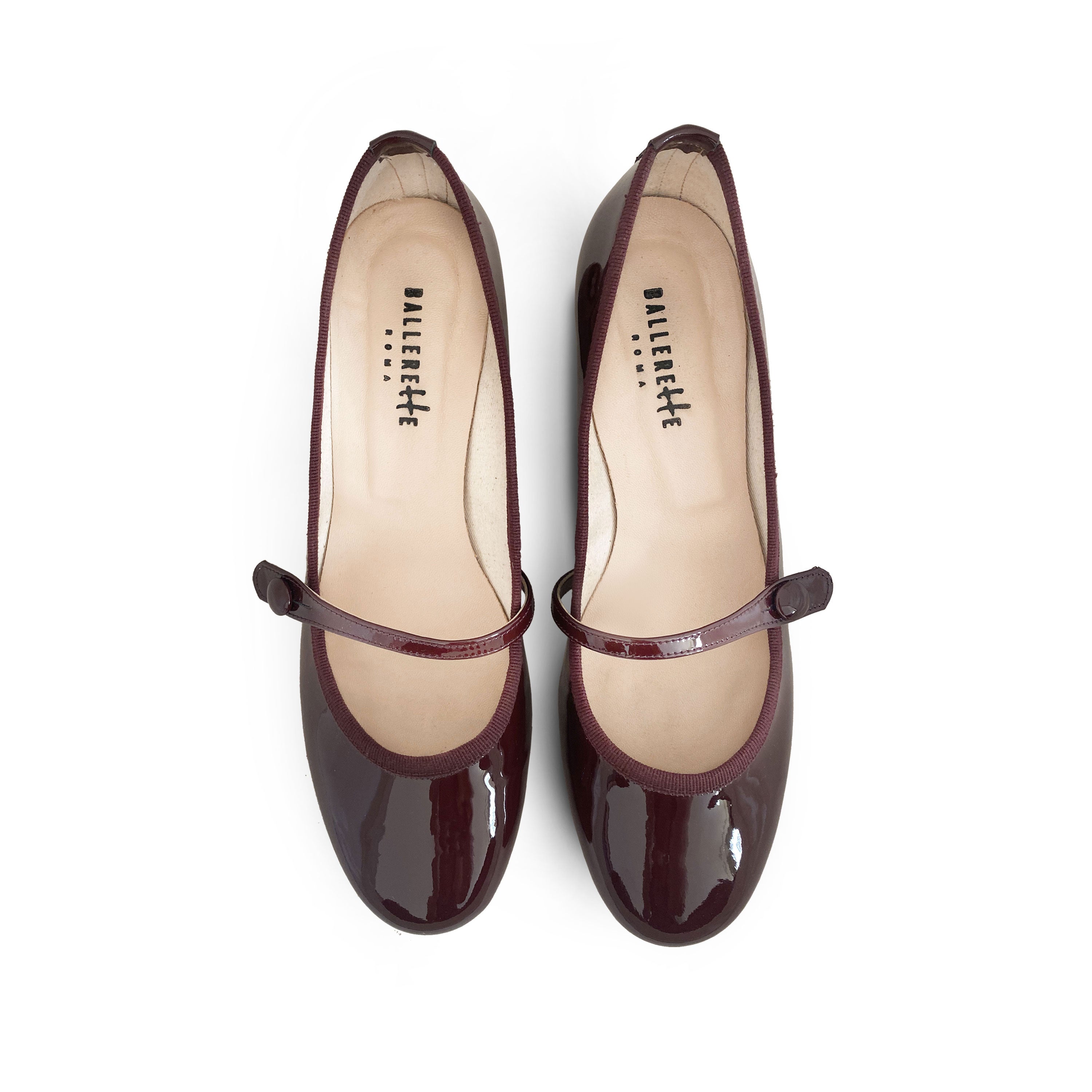 Burgundy patent leather Mary Jane ballet flats with strap and heel