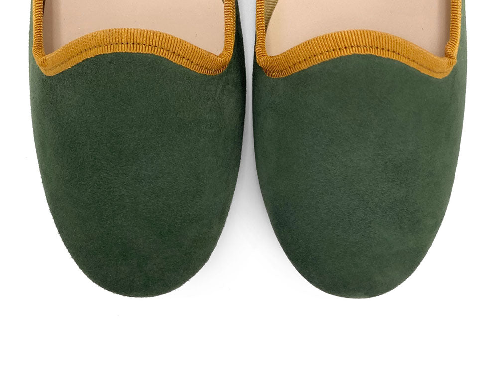 Forest green suede loafers with amber yellow details