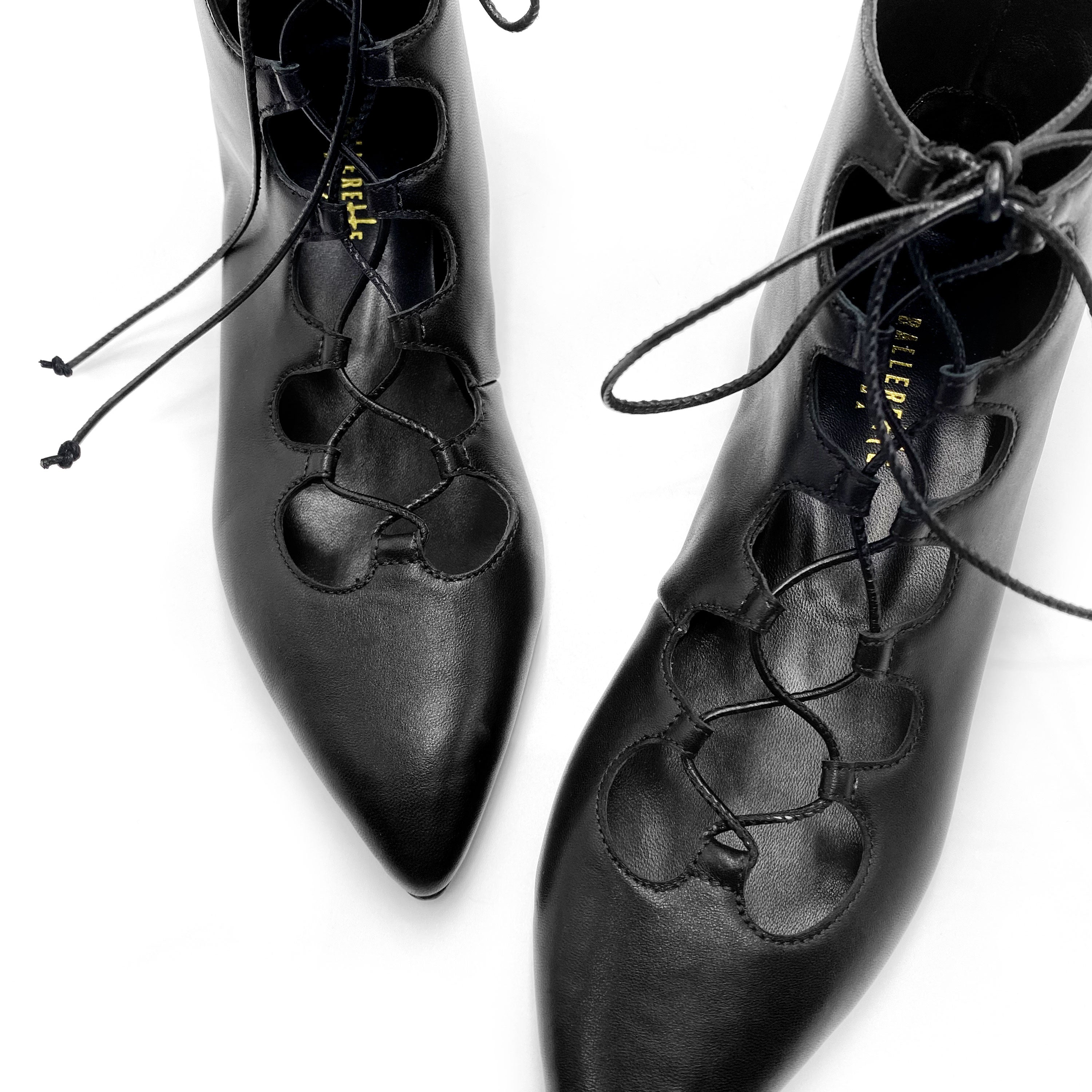 Black pointed ankle boots with laces