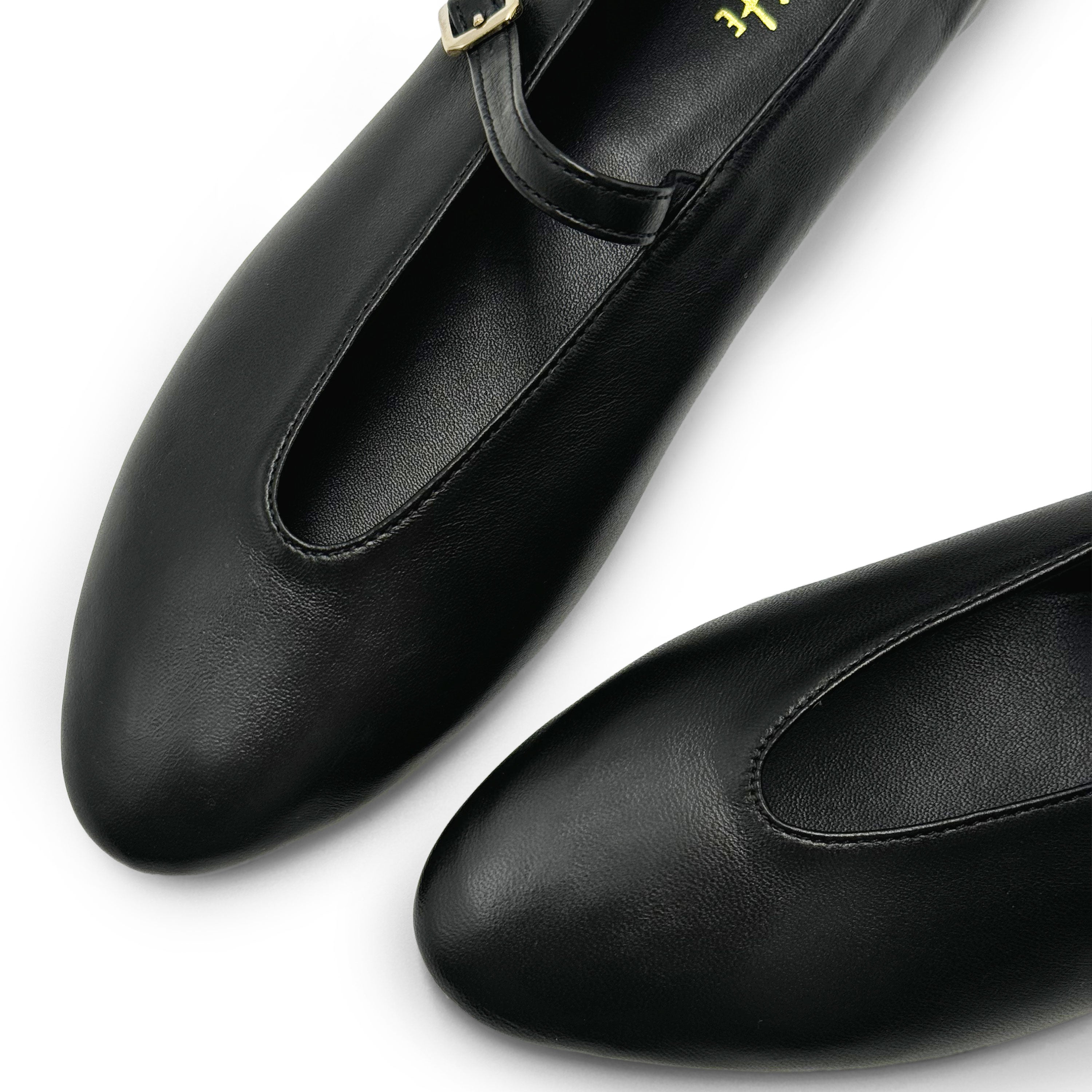 Black leather ballet flats with V-cut and strap