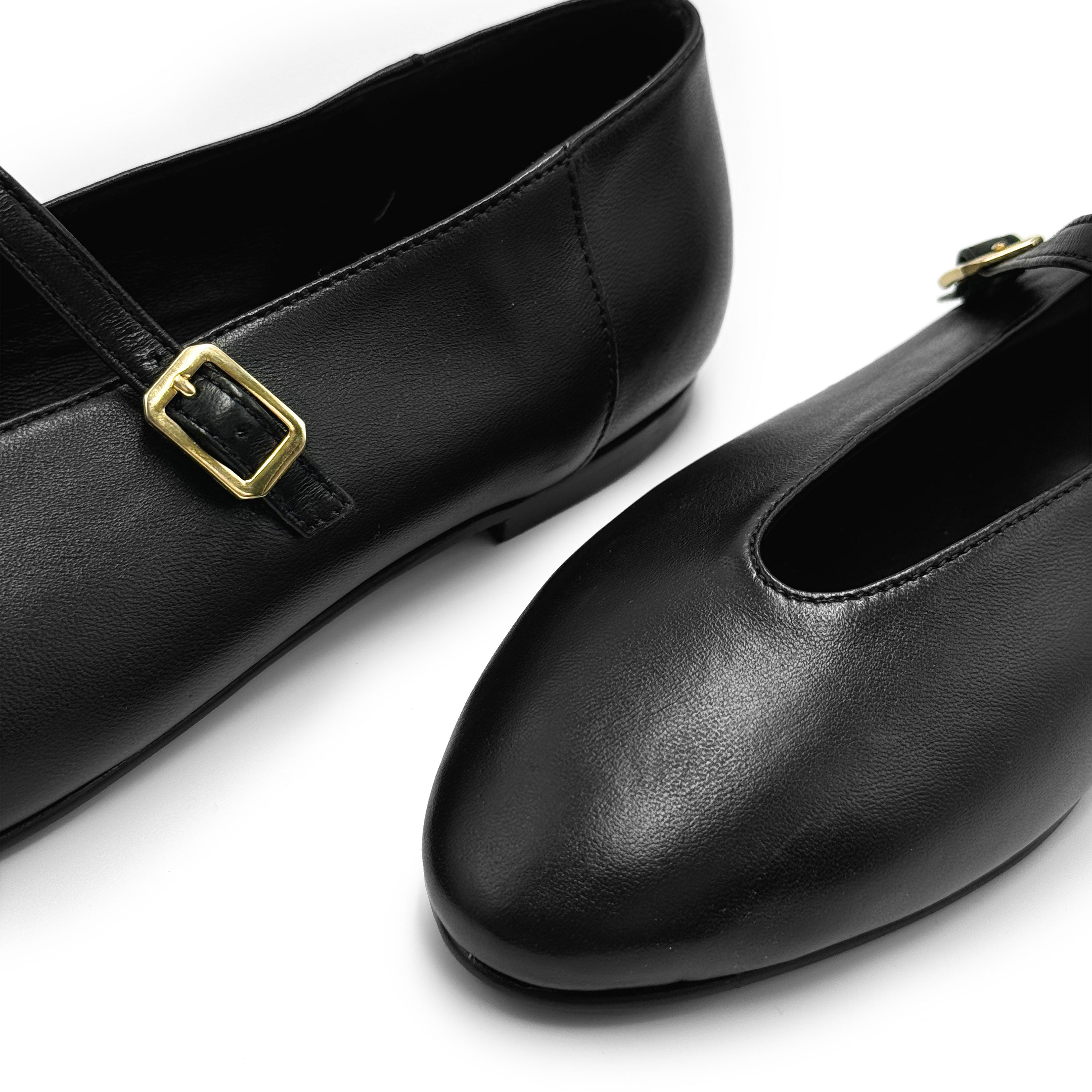 Black leather ballet flats with V-cut and strap