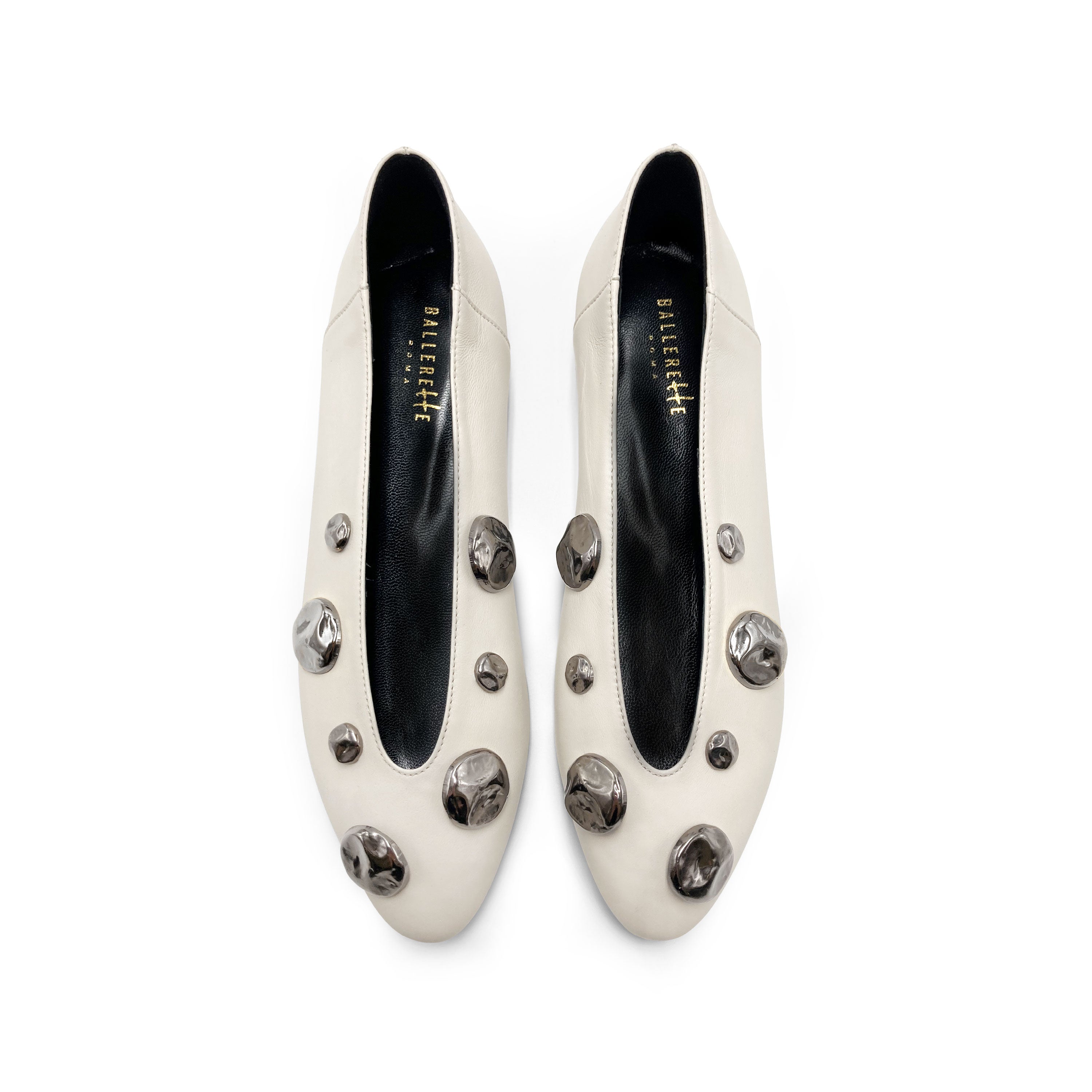 Ivory white leather ballet flats with V-cut and iron studs