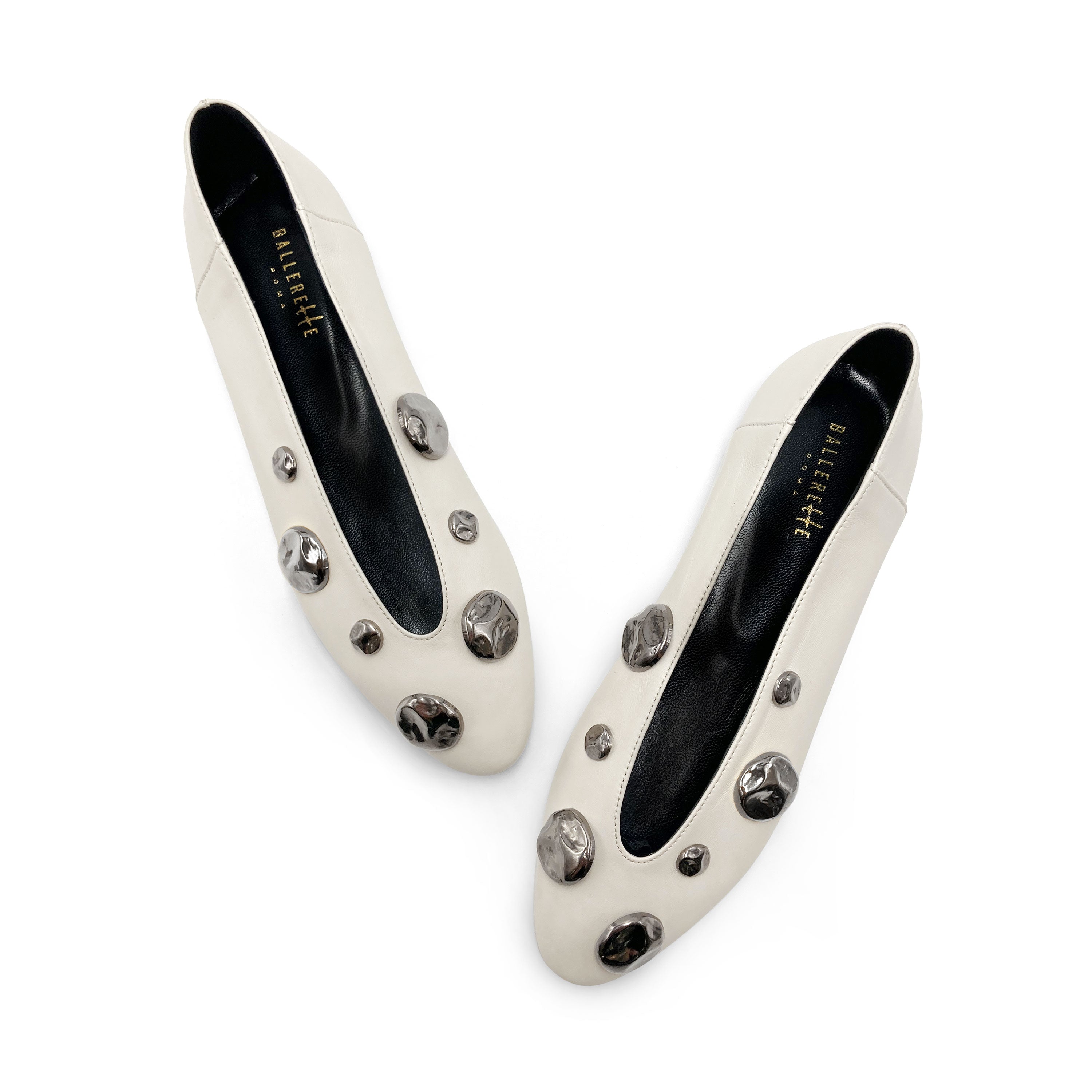 Ivory white leather ballet flats with V-cut and iron studs